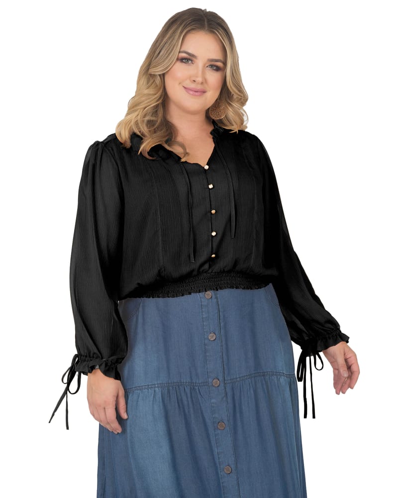 Front of a model wearing a size 3X Jessica Tie-Neck Prairie Top in Black by Standards & Practices. | dia_product_style_image_id:275973